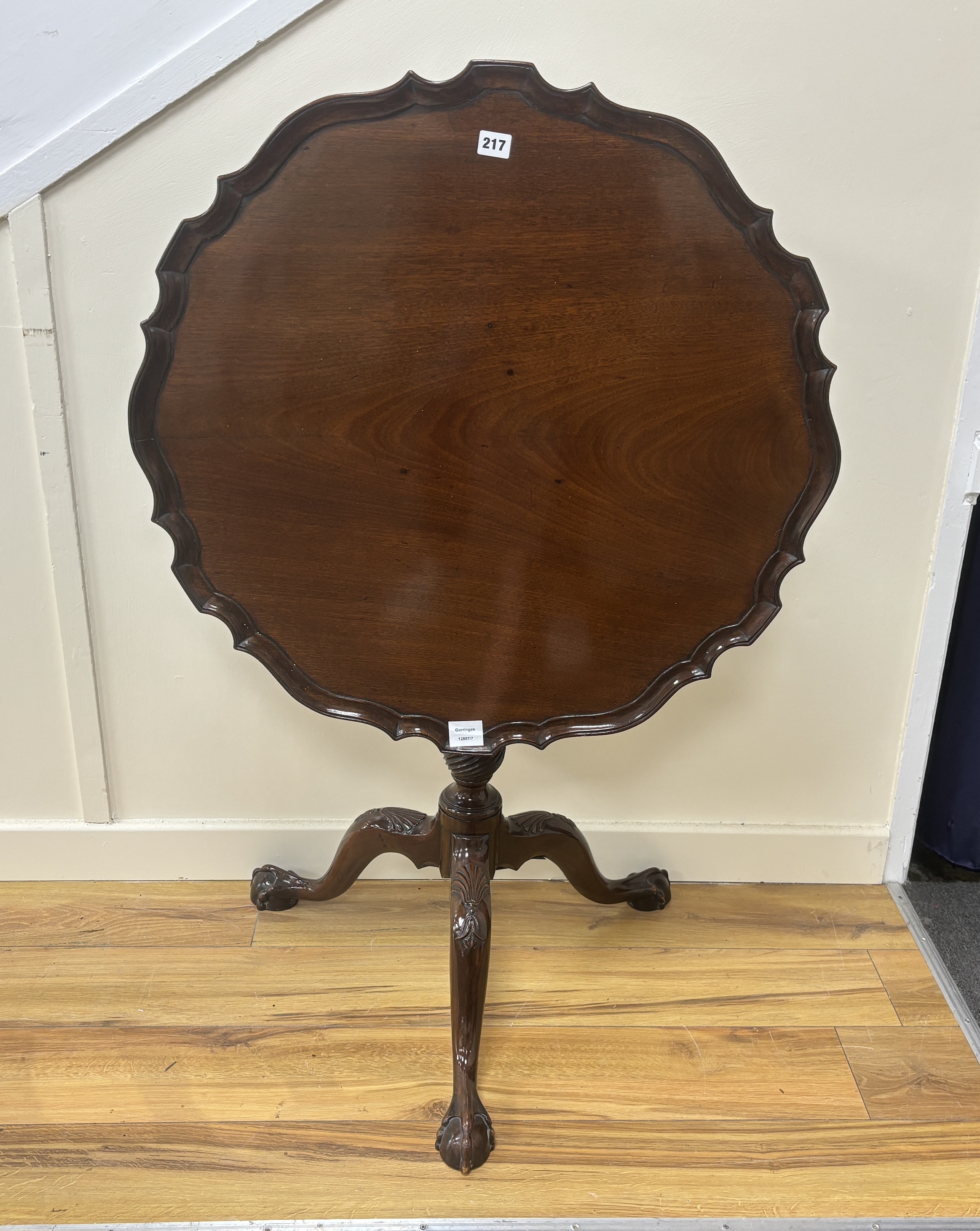 A George III circular mahogany tilt top birdcage tripod tea table, diameter 76cm, height 74cm